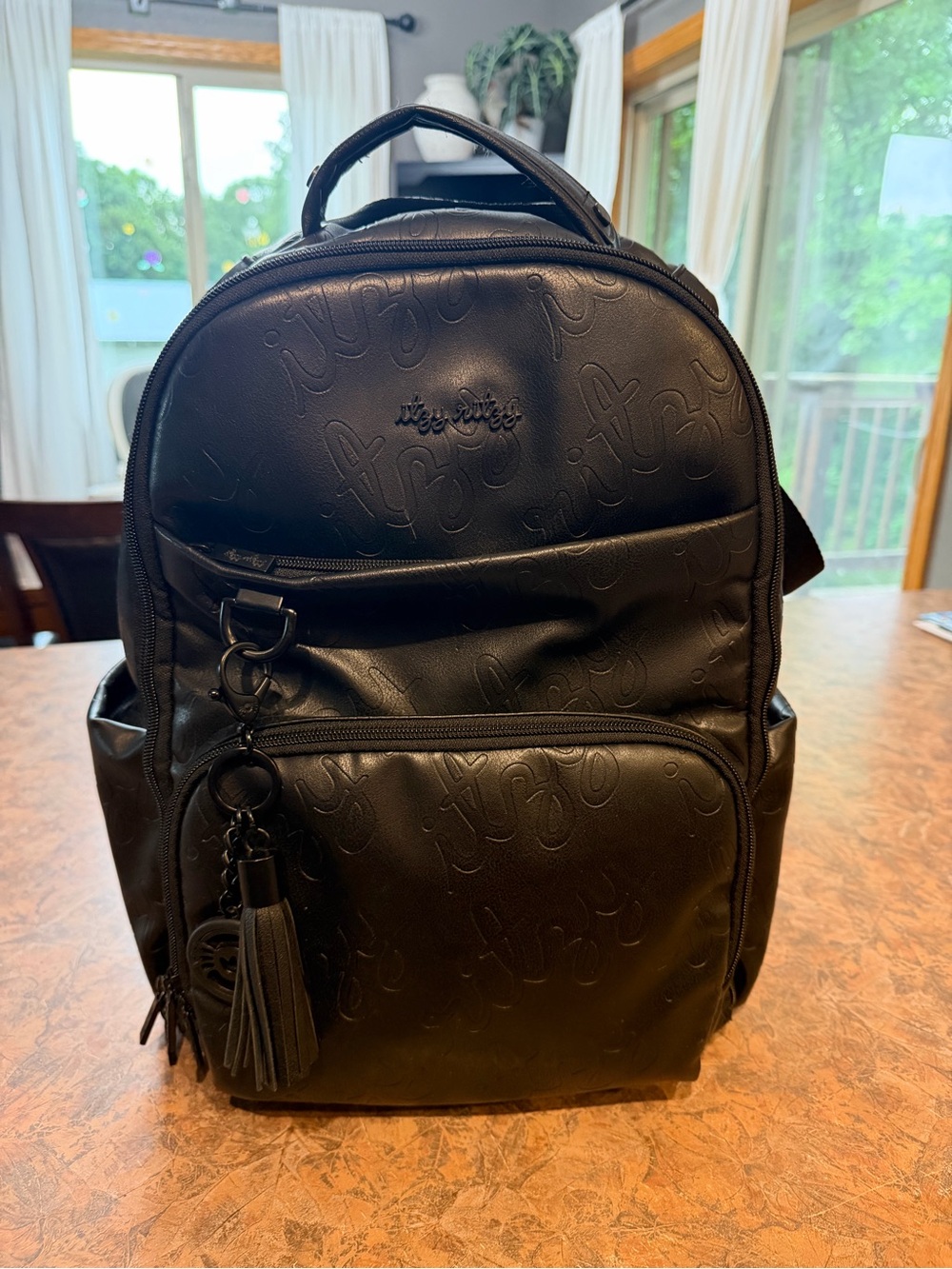 Itzy Ritzy Black Embossed Kids Backpack with Tassel Charm